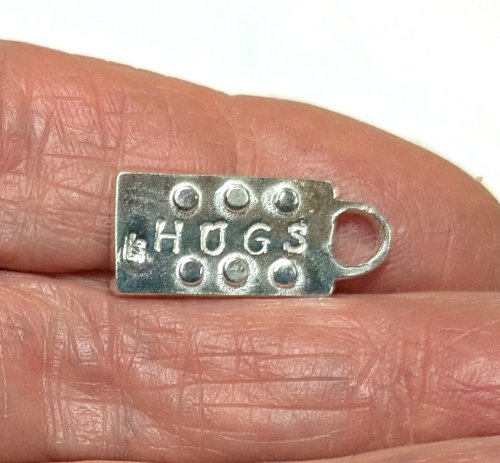 Judy Larson's Hearts and Flowers Charms - , Classic Wire Jewelry, Cutting, Cutting Tool, Cutters, Filing, Finishing, Butane Torch, Soldering, Solder, Design, Back: 20 gauge dots made with 1.8mm hole punch.